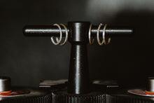 Load image into Gallery viewer, Silver stackable ring set hung on a display with five different dainty stackable ring styles